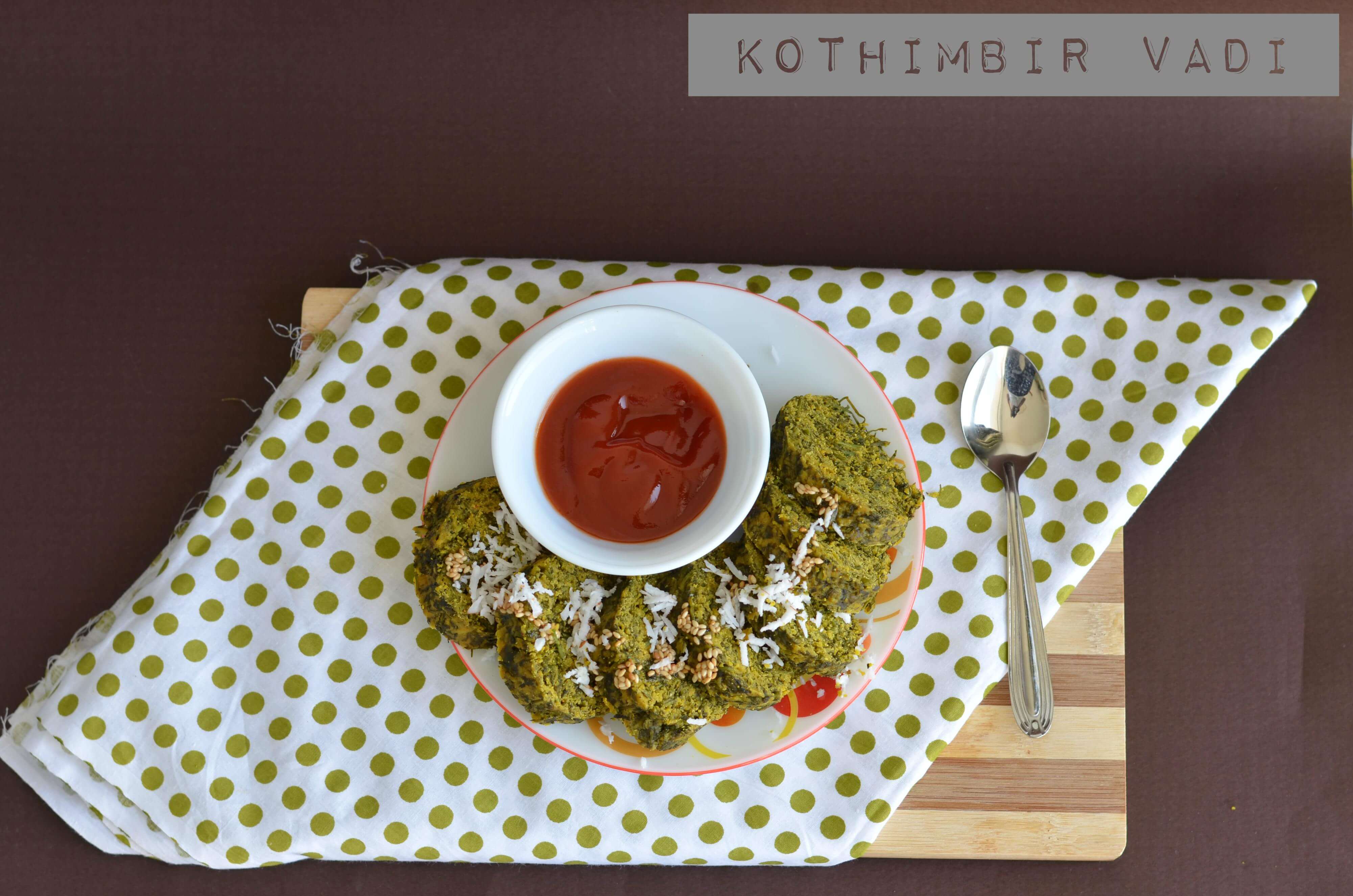Kothimbir Vadi | Kothimbir Vadi is a popular Maharashtrian snack which is steamed and pan-fried. It is made with fresh coriander leaves, chickpea flour, spiced up using ginger, garlic, green chili, garam masala. Kothimbir Vadi is a popular Maharashtrian snack which is steamed and pan-fried. It is made with fresh coriander leaves, chickpea flour, spiced up using ginger, garlic, green chili, garam masala. Kothimbir Vadi is a glutenfree snack, you can have it in breakfast or a side dish in the Maharashtrian thali.