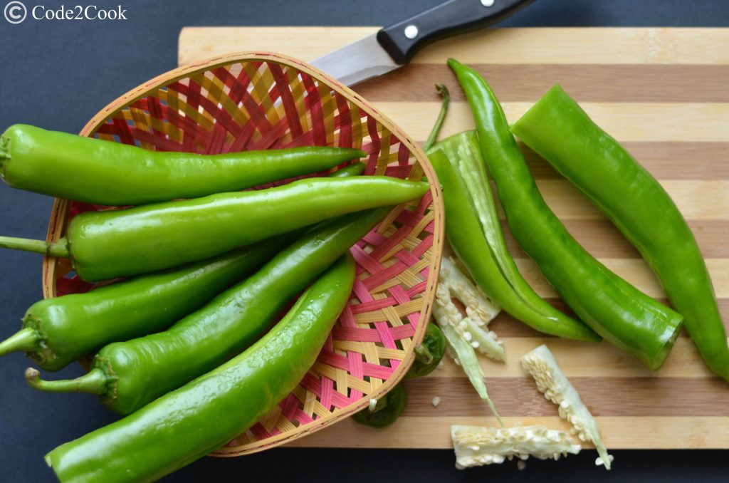 Bherwa Mirch Ka Pakora | Stuffed Green Chili Fritters Bherwa Mirch ka pakora is stuffed green peppers with mashed potatoes filling with some aromatics spices, dipped in spicy besan (gram flour) batter and deep fried. It is a popular Rajasthani street food known as bherwa mirch vada too.