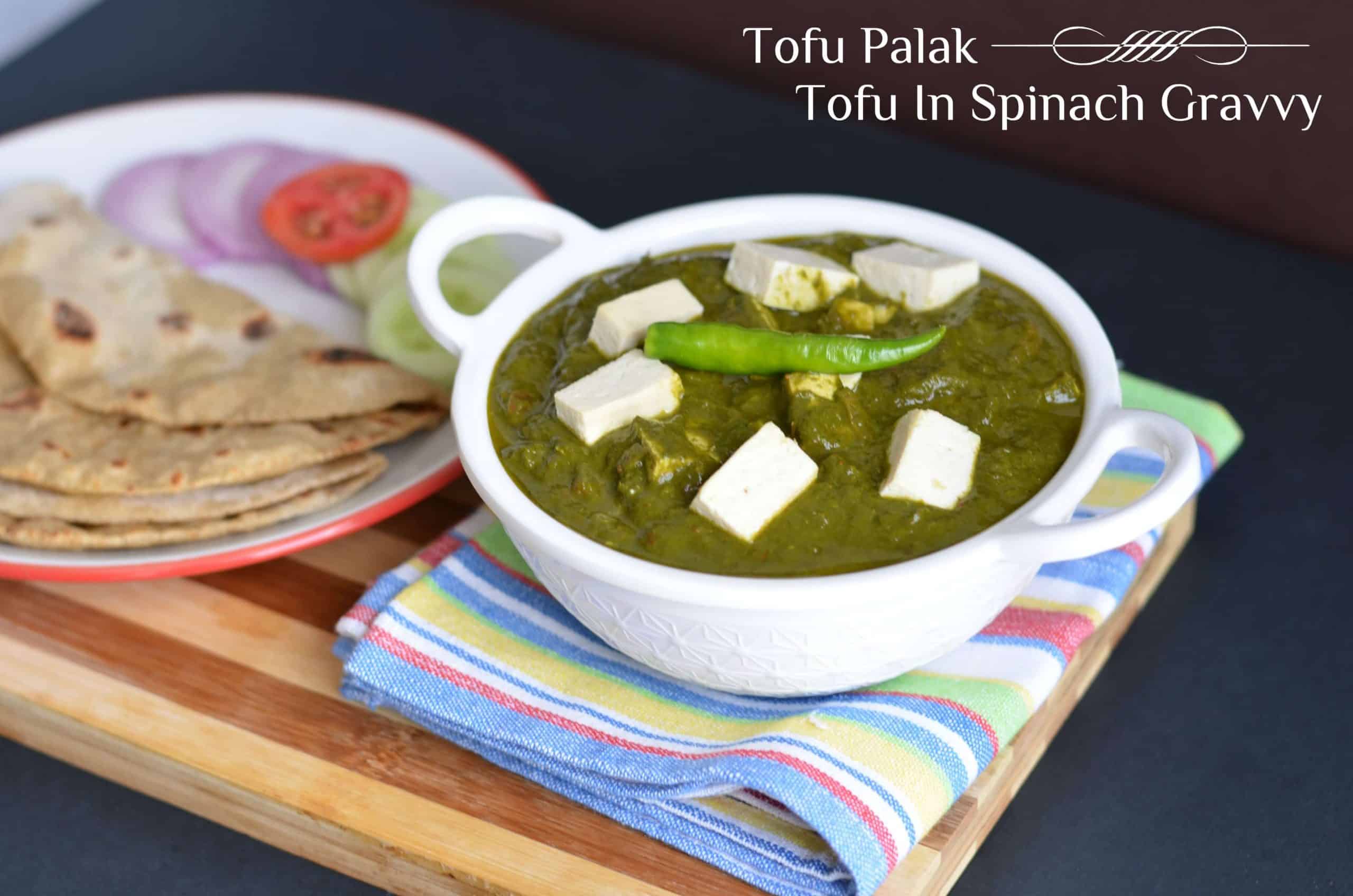 Tofu palak or tofu in spinach gravy is pan fried tofu, cooked in spinach puree with onion-tomato and garam masala. Garnished with fresh cream this lip-smacking tofu palak gravy is a great combination with nan or rice. You can never go wrong with this delicious dish.