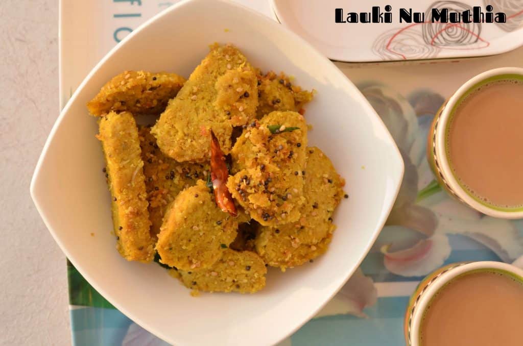 Lauki Ki Muthiya | Steamed Bottle Gourd Dumplings Lauki Nu Muthia or lauki muthia or bottle gourd's steamed dumplings is a popular Gujarati tea time snack, having less oil but very tasty and nutritious. Muthi means fist, this snack is named as muthia because we have to shape them in a cylindrical shape with the help of fist. Lauki Nu Muthia is a very healthy snack as it is steamed. You can shallow fry as well if needed.