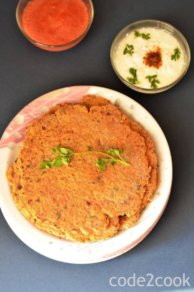 Rajgira Paratha Recipe | Vrat Ka Paratha | Farali Paratha rajgira paratha is served on white plate. Coriander leave are kept over it.