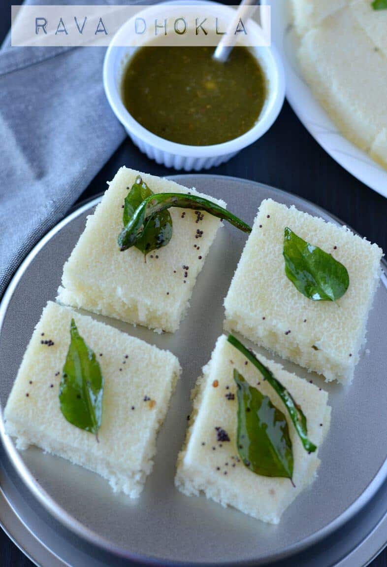 Rava dhokla is a fluffy and soft snack from Gujarat in India. Dhokla is a very popular dish from Gujarat, with many variations like besan dhokla, rava dhokla, dal dhokla, tiranga dhokla to name few. These take just 30 minutes to prepare and great for kid's tiffin box as well. Out of all varieties, besan or khaman dhokla and rava dhokla are the most popular ones.