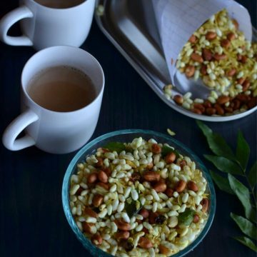 Murmura namkeen or murmura chivda is a healthy, light and crunchy snack. It takes only 15 minutes to prepare this crispy namkeen with no fancy ingredients. This crispy murmura chivda is prepared tossing peanut, murmura, poha in spices with green chili and mustard seed tempering.
