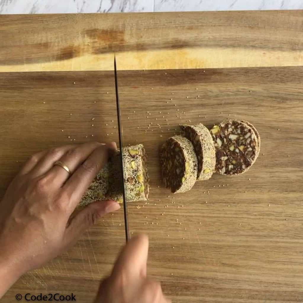 cutting the roll into 1 inch long circles.