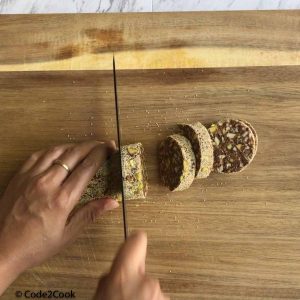 cutting the roll into 1 inch long circles.