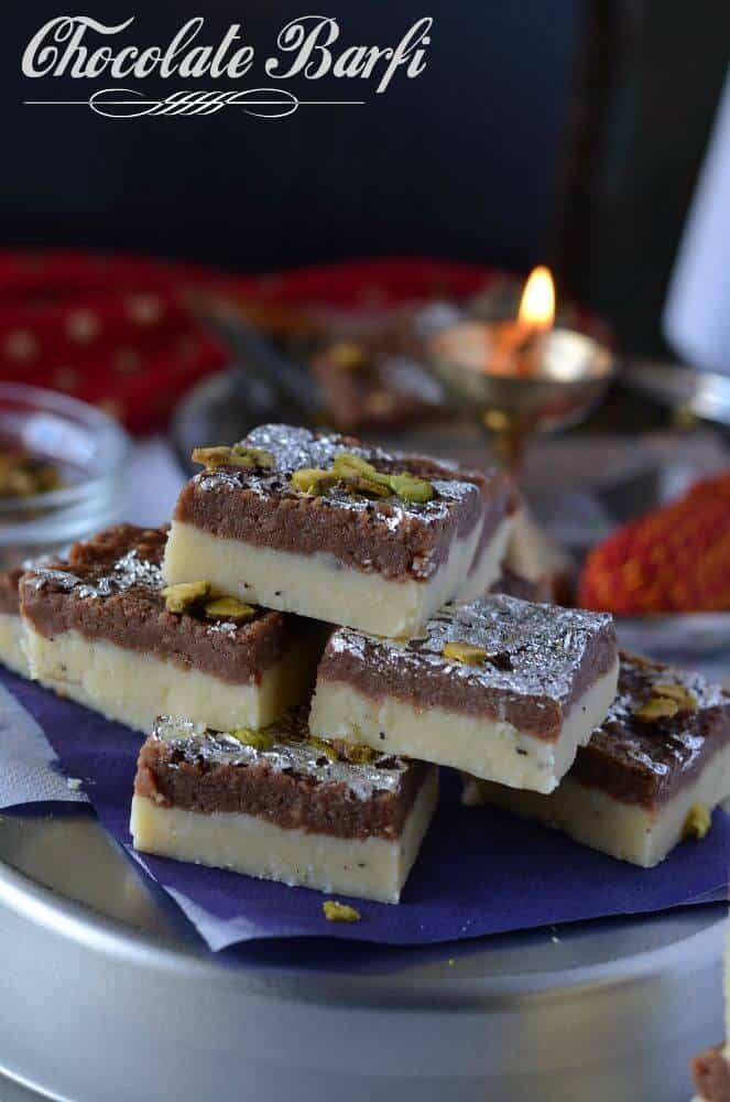 Chocolate burfi is one of the popular Indian festival sweet prepared during Diwali. It is a khoya burfi or mawa burfi recipe. Chocolate burfi is two layered burfi recipe, where the bottom layer is plain mawa layer and the top layer is chocolate flavored.