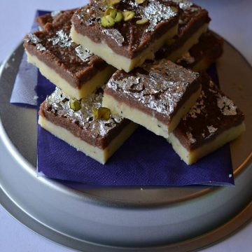 Chocolate burfi is one of the popular Indian festival sweet prepared during Diwali. It is a khoya burfi or mawa burfi recipe. Chocolate burfi is two layered burfi recipe, where the bottom layer is plain mawa layer and the top layer is chocolate flavored.
