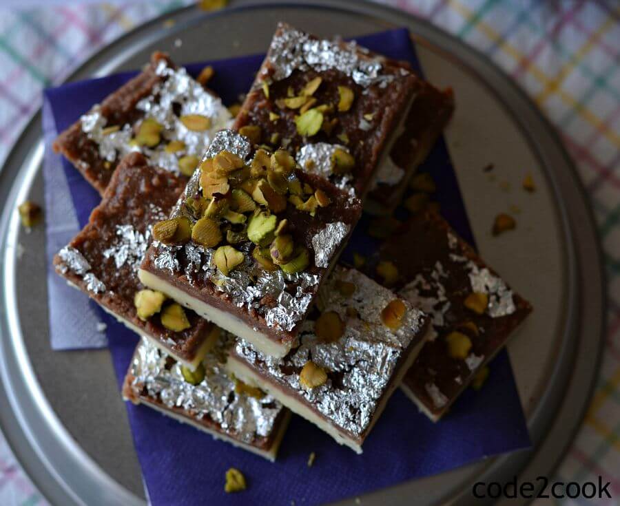 Chocolate burfi is one of the popular Indian festival sweet prepared during Diwali. It is a khoya burfi or mawa burfi recipe. Chocolate burfi is two layered burfi recipe, where the bottom layer is plain mawa layer and the top layer is chocolate flavored.