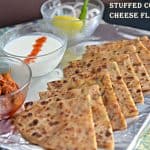 Paneer Paratha is very famous paratha and often served with curd or pickle mostly in every restaurant in India. This is an Indian flatbread which is stuffed with grated paneer or cottage cheese stuffing and seasoned with few spices. A great tiffin box recipe and can be eaten in any meal.