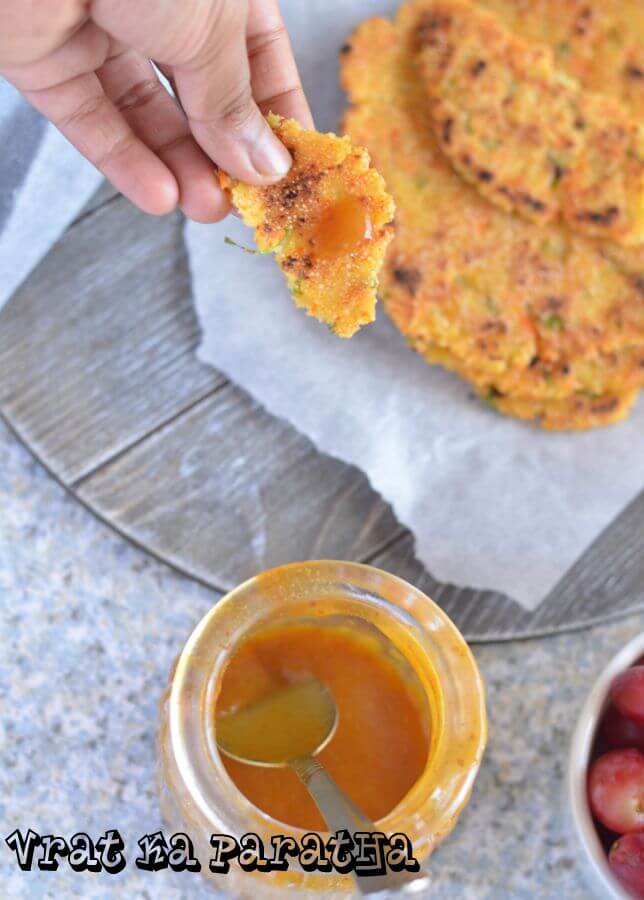 Vrat ka paratha or sama rice paratha is served on wooden board with no-cook peach chutney.