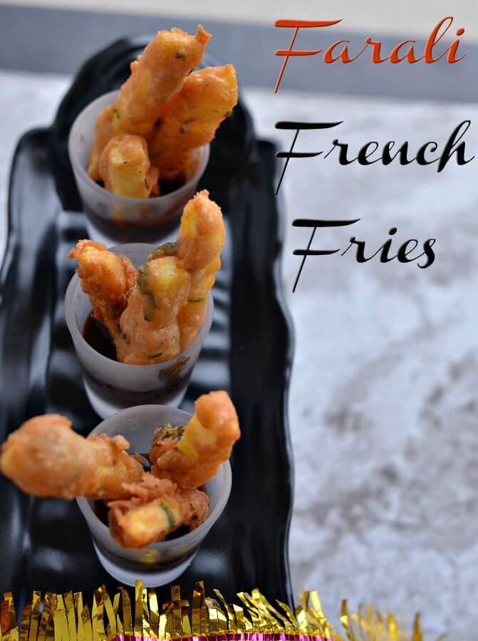 Farali French Fries | Vrat Ke French Fries | Rajgira Flour French Fries farali french fries served in mini glasses with chutney. Mini glasses are kept on black tray.