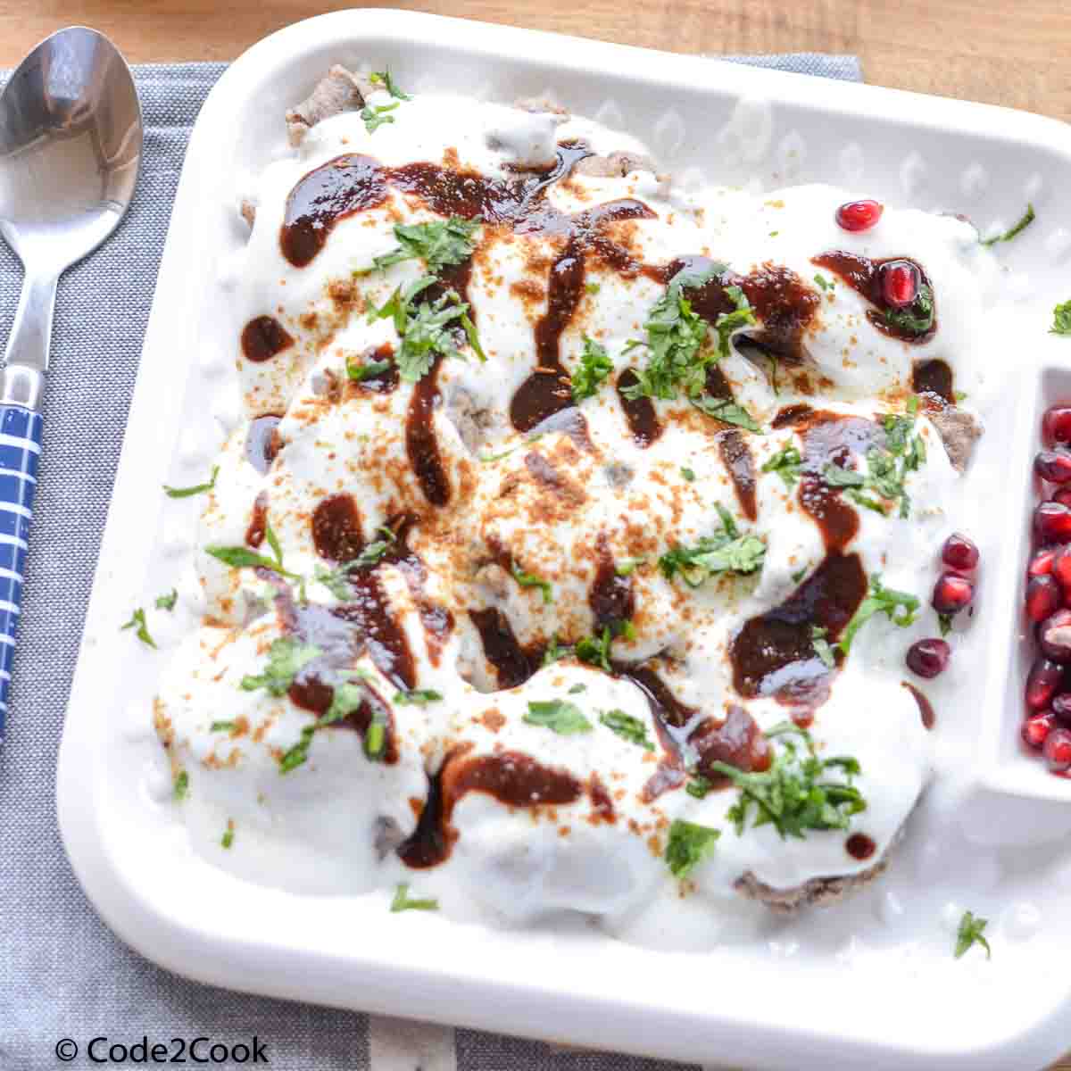 buckwheat dumplings are served with all garnishing on a white plate