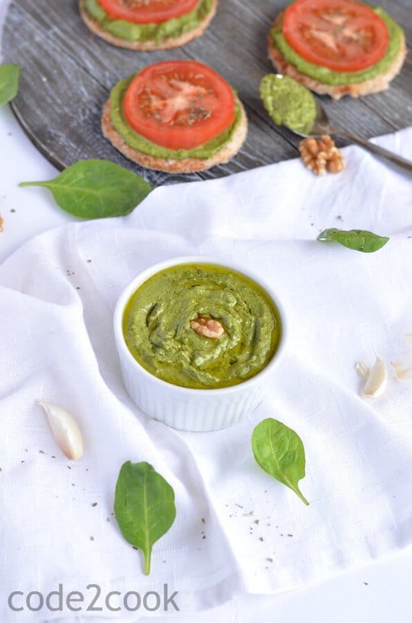 Spinach Pesto With Walnut | Vegan | Gluten-Free Homemade spinach pesto is easy to make, and packed with the goodness of spinach, olive oil, and walnut. This Italian pesto is vegan & Gluten-free. This Spinach Pesto is made without permesan cheese.