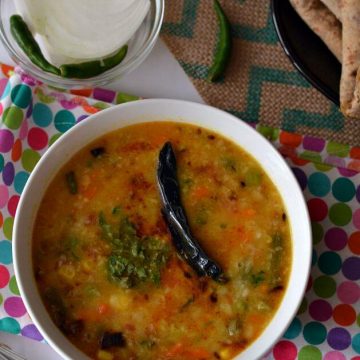 Mix vegetable moong dal is a healthy, nutritious and a flavorful vegan lentil recipe. This is a wholesome lentil soup with loads of vegetables with fewer spices. This one pot dal is very easy to make and gets ready under 30 minutes.