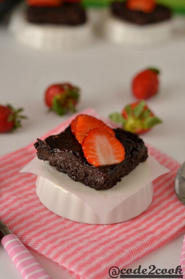 Eggless strawberry brownie is a sweet, tangy, and chocolate flavored fudge brownie for Valentine's day but can be made on any occasion. Basically, it is kind of chocolate covered strawberries in fudgy brownie form. Eggless Strawberry brownie is easy to make brownie recipe with healthy ingredients and fresh strawberries. It is best served with vanilla ice cream or whipped cream or just sliced strawberries.
