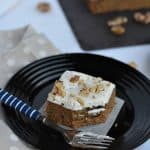 This vegan banana walnut cake is soft, moist and with coconut cream frosting on top. Made with whole wheat flour, spiced with cinnamon and chewy roasted walnut inside, this vegan banana cake is loved by all. You can have chocolate ganache or any frosting on a banana sheet cake and tweak the taste. But must say I finally found the best recipe to make an eggless banana walnut cake.