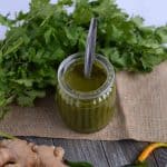 green chutney for chaat is served in glass jar. hari chutney or green coriander chutney