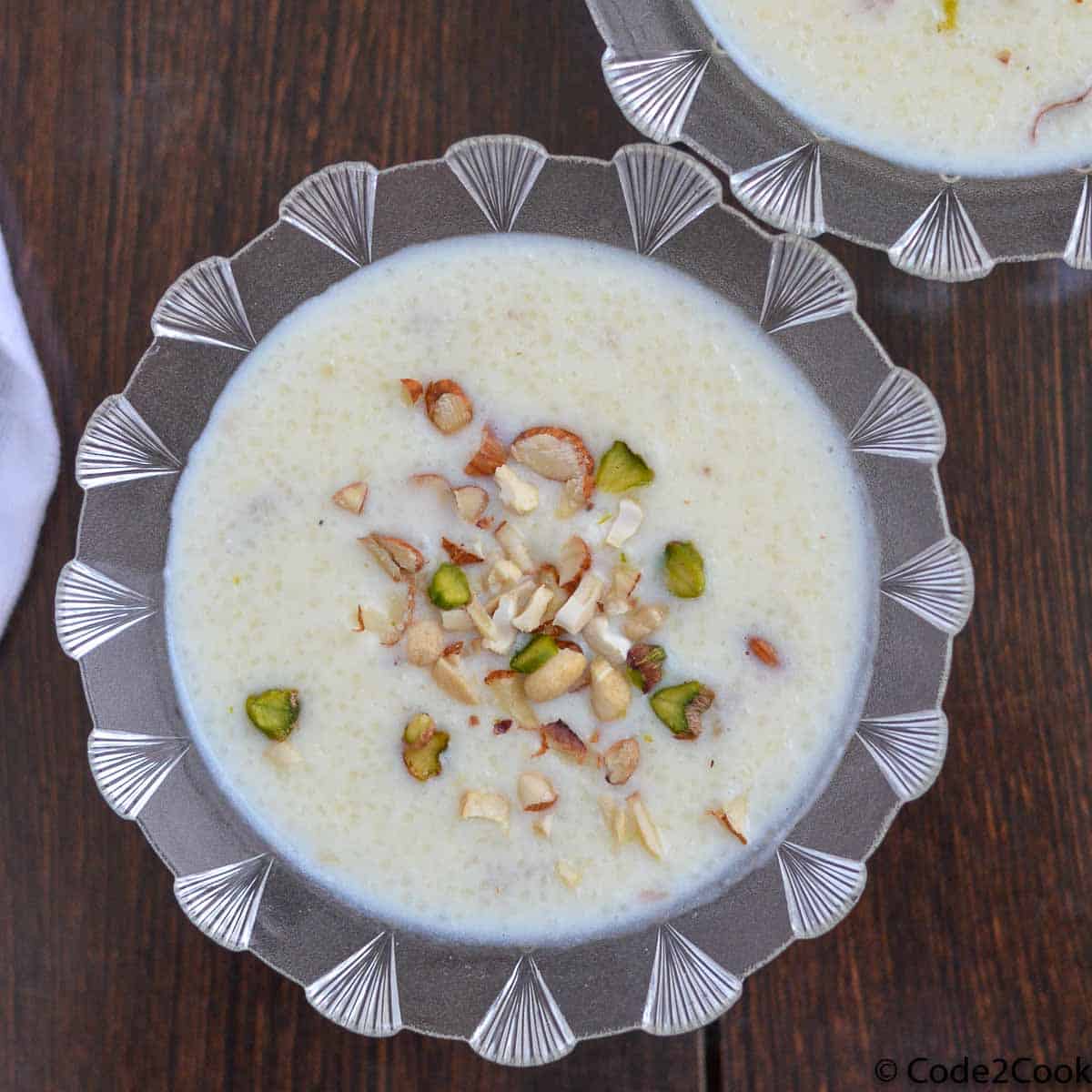 samak rice kheer served in glass bowl and sprinkle chopped dry fruits. Overhead shot of sama rice kheer
