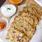 capsicum paratha served with chutney, curd and pickle.