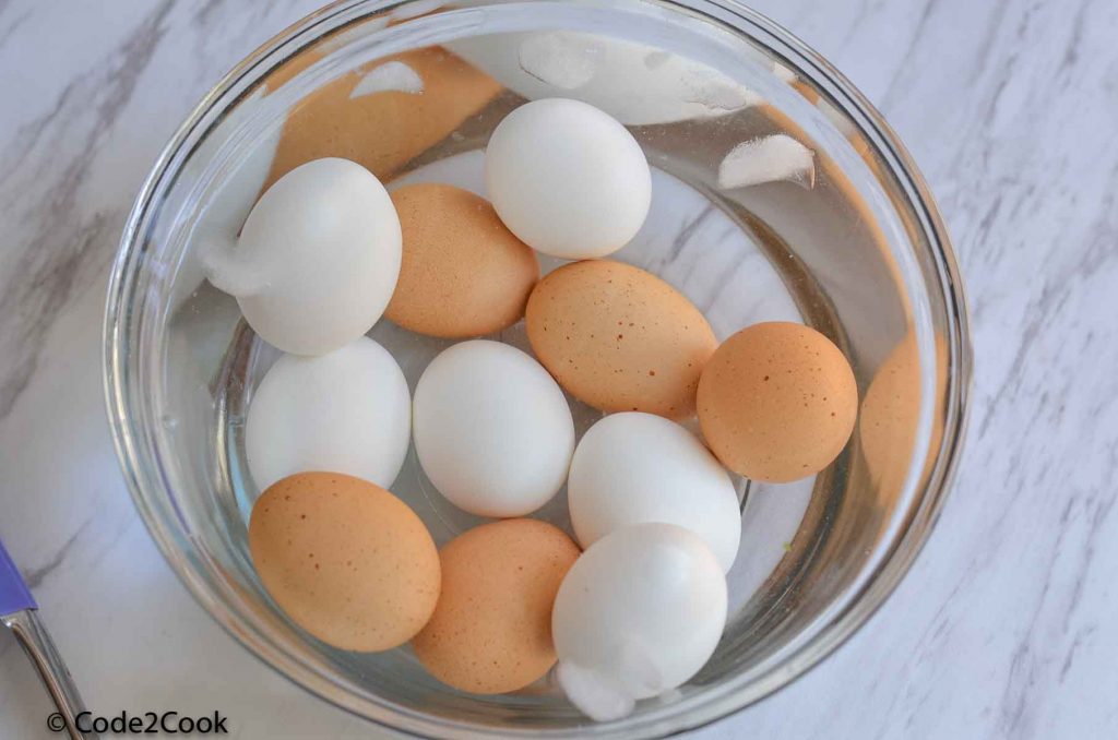 Eggs are kept in ice water for five minutes.