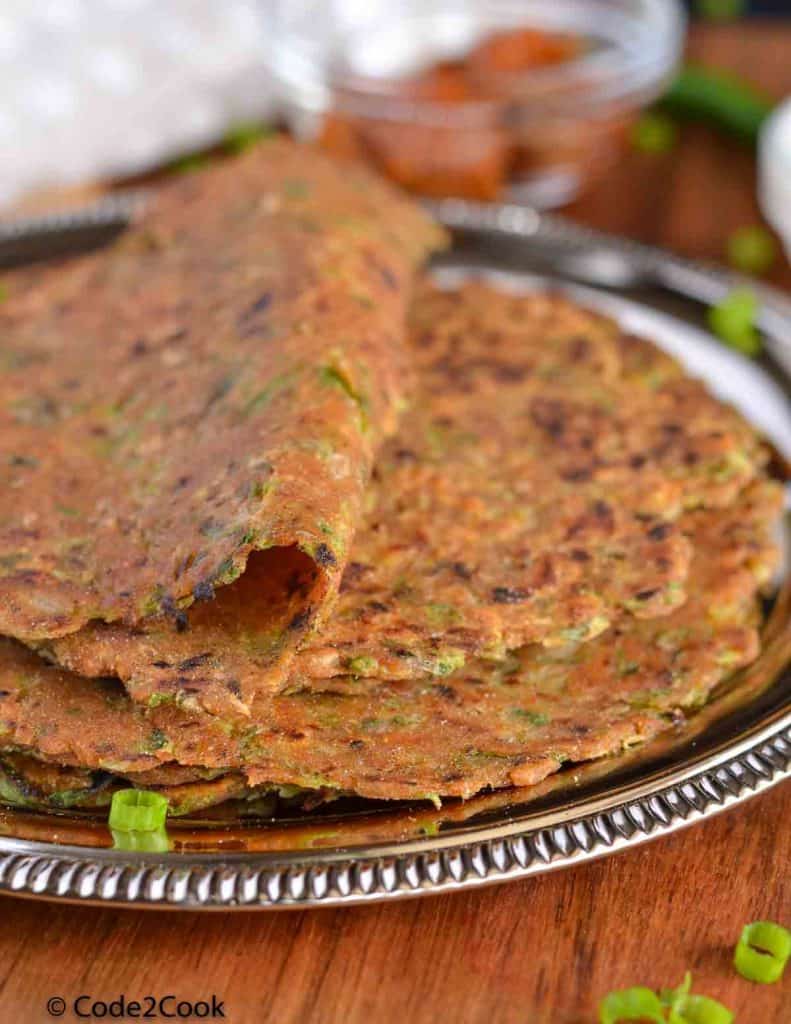 a close up click of spring onion paratha