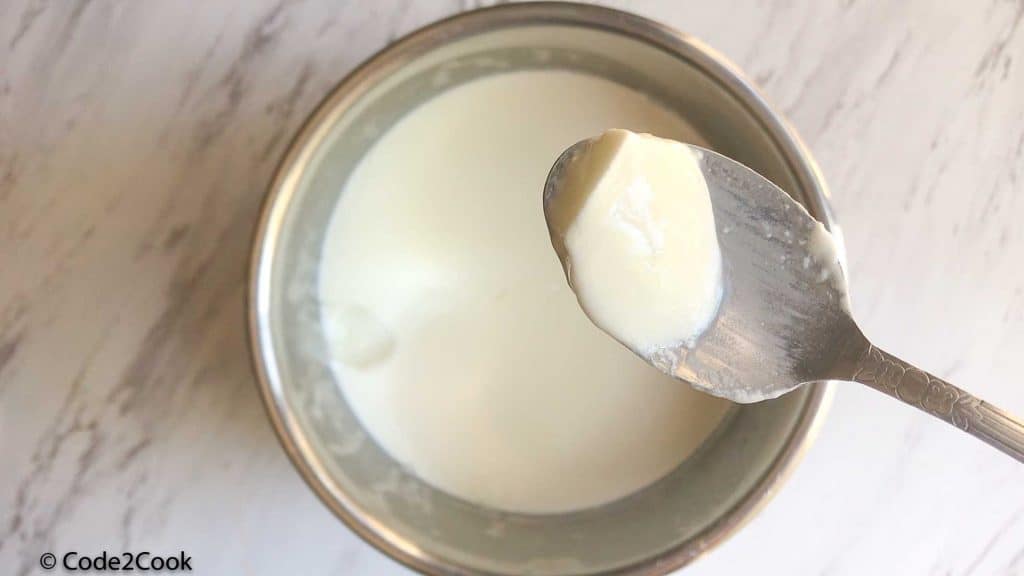 close up click of spoonful yogurt