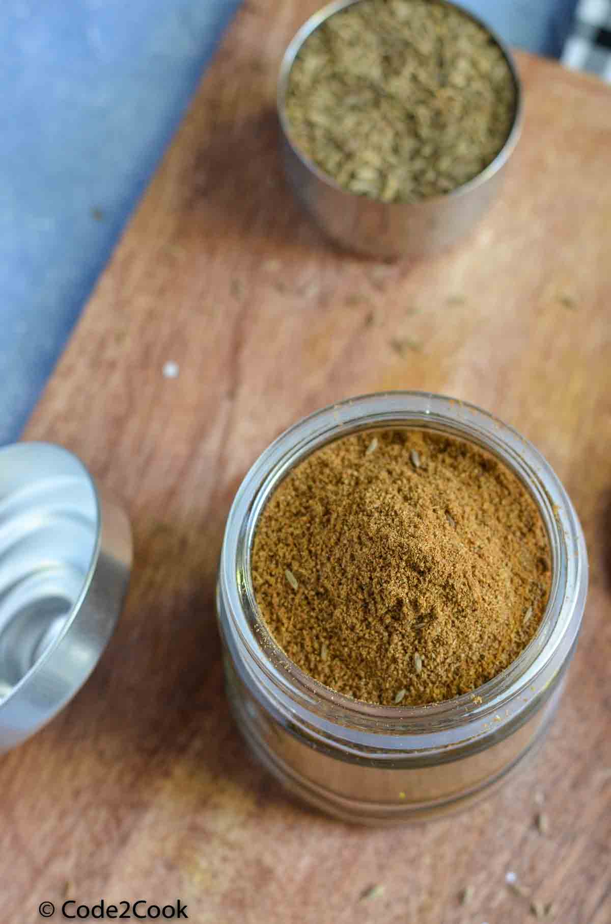 cumin seed powder in a glass jar
