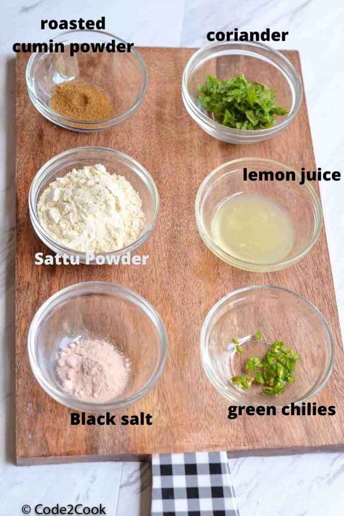 ingredients of sattu drink kept in glass bowls.