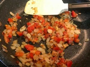 Cooking the mixture for spinach chutney